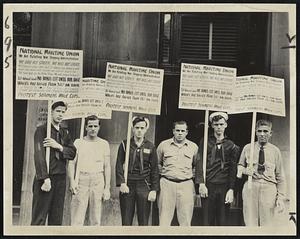 Protest Seamen's Bonus Cut--Pickets who walked in front of War Shipping Administration office at 40 Broad street today to protest against the proposed cut in bonus for merchant seamen.