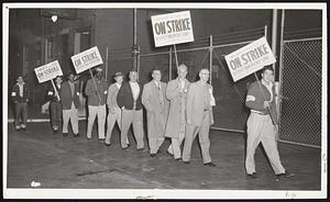Pickets Took Positions on Gore St., Cambridge, early today as part of a strike against Swift & Co., meat packing plants in 35 cities across the country. Pickets also paraded in Somerville. Dispute involves wages and a union shop. The negotiations, involving two unions, broke off in Chicago.