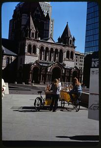 Two people selling pretzels, Copley Square, Trinity Church in background