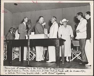 Principals at dedication of the Music Center at Tanglewood. At left Richard C. Paine, center Olin Downes shaking hands with Dr. Koussevitzky as Gertrude Robinson Smith chats with Albert Spaulding