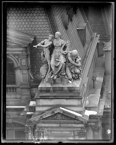 Sculpture on top of the old Boston US Post Office building by D. C. French titled "Science Controlling the Forces of Electricity and Steam"