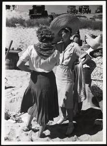 Siasconset clam bake Mrs John Scott + Mrs. Ernest Smith (large hat - smoking)