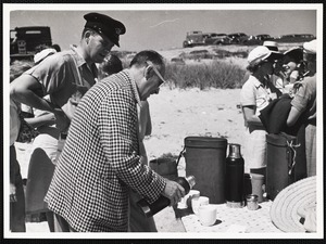 Siasconset clam bake Floyd Waggaman pouring martini for Commander Giffand