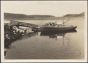 View of boat, Enfield, docked at Administration Building Complex, Quabbin Reservoir, Belchertown, Mass., ca. 1941