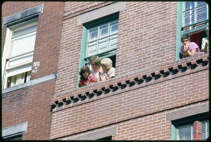 People looking out window