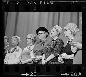 Elderly women sing at concert, Hynes Auditorium