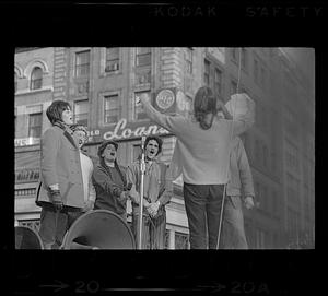 Singing anti-war war songs, downtown Boston