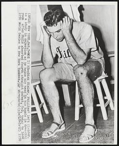 Woe Is Me--Dick Sisler, Phillies' left fielder, is a study in dejection as he holds his head in his hands in dressing room after Phils absorbed fourth straight defeat, 5-2, today to lose 1950 World Series to New York Yankees.