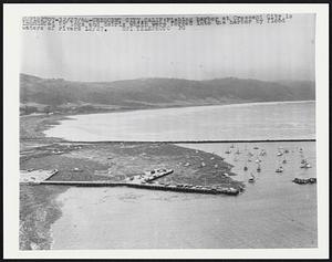 Fishing harbor at Crescent City is inundated by logs and debris which were forced into the harbor by flood waters of rivers 12/27.