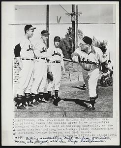 Indian Hurlers Get Pitch. Roving pitching coach Red Ruffing gives three prospective Cleveland hurlers the word on throwing baseballs, as the rookies started training here today. (LtoR) Pitchers are Al Jurisich, George Zuverink and Dick Rozek. Add- Batting is outfielder Milt Nielson, of Windom, Minn., who played with San Diego last season.