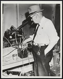 Water Carburetor Patented. Henry (dad) Garrett, 76, electrician, inventor and supervisor of the Municipal Traffic Signal System here is pictured with his electrolytic carburetor, Garrett says, will make one gallon of water run an automobile as far as 2,000 gallons of gasoline would run it. A solution of water and common house lye is introduced into the carburetor, breaking the water down into its components of hydrogen and oxygen which in turn is fed into the motor as vaporized gasoline. Only a few minor adjustments are necessary for installation in automobiles. Commercial firms are bickering at present with the inventor to see if it works.