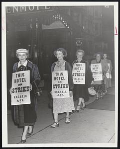 Striking Hotel Employes form a picket line outside the Kenmore Hotel. The strikers are members of the Hotel and Restaurant and Bartenders International Union, AFL. They also walked out at the Somerset Hotel.