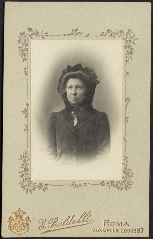 Woman in dark dress/overcoat and bonnet