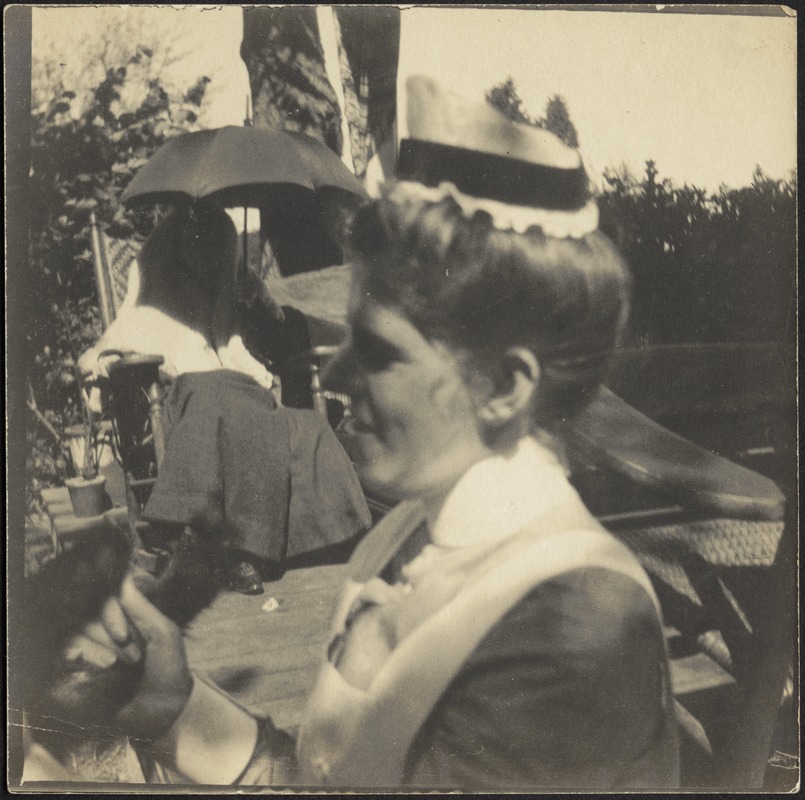 Isabel Stevens in nurse uniform sitting on patio