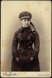 Portrait of Lila Sutton in winter dress with black lambswool muff