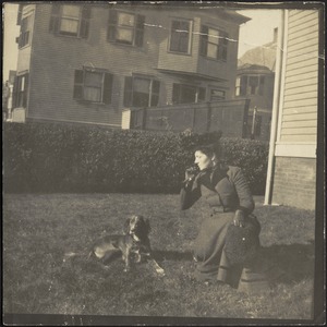 Gertrude S. Kunhardt with dog on lawn