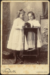 Helen and Isabel Stevens reading a book