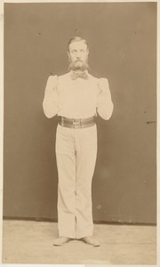 Untitled (man doing exercises in white suit)