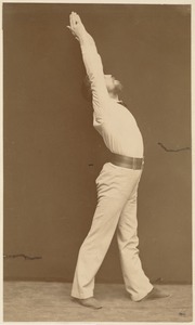 Untitled (man doing exercises with arms reaching over his head)