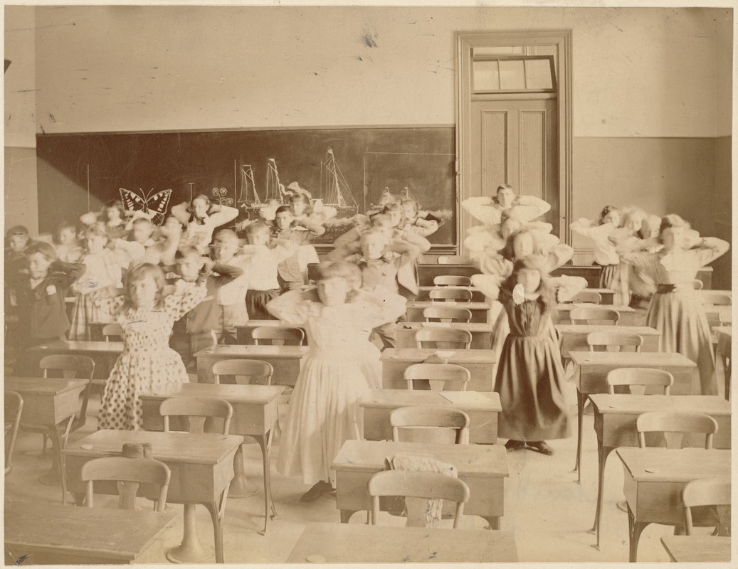 Untitled (classroom of students standing & doing exercises)