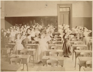 Untitled (classroom of students standing & doing exercises)