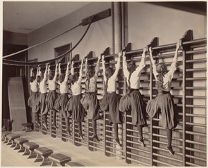 Charlestown High School (girls exercising on bars against the wall)