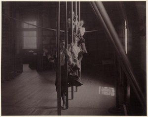 Charlestown High School - four girls climbing poles (front view)