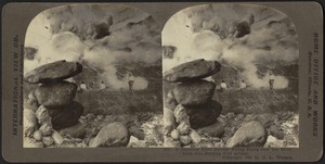 A Japanese field battery firing shells over the mountains into burning Port Arthur