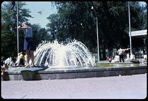 People by a fountain