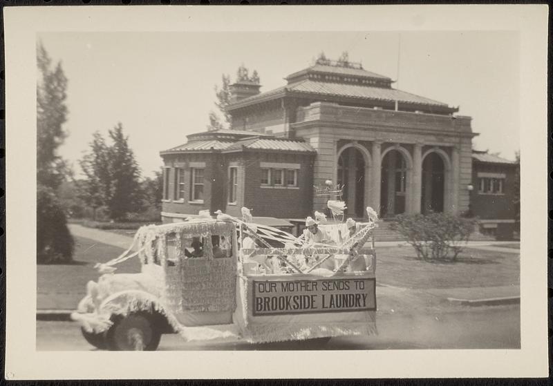 Parade decorated truck in front of Lawrence Library