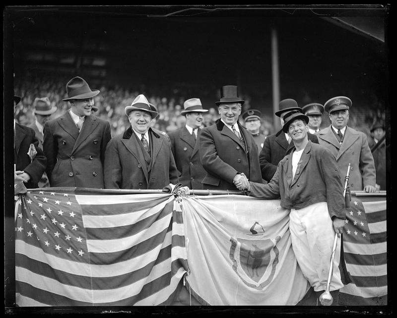 James Curley shaking a man's hand