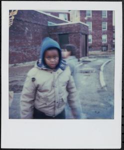 Boy in hoodie outside