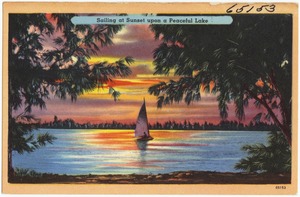 Sailing at sunset upon a peaceful lake