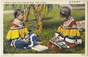 Seminole Indian girls stringing beads, Miami, Florida