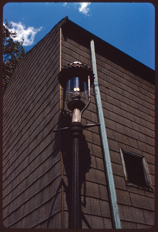 Street light at exterior corner of building, Boston Digital Commonwealth