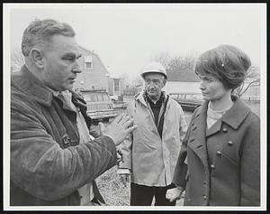 Left Ray Kane Frank Flanagan both of U.S. Army Corps discussing wife Mrs. Margaret Heckler at Taunton Damm