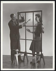 Make Your Own Safety Glass M. A. Dorian, Chief Chemist of Roxalin Flexible Finishes, Elizabeth, New Jersey, is demonstrating Roxaneal, a new transparent liquid coating that prevents flying glass splinters due to concussion and vibration during air raids. The new material does not obstruct light, is applied by brushing, and may be cleaned with soap and water. When the emergency is over, Roxaneal can be easily removed.