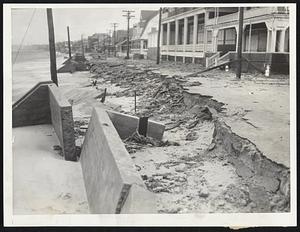 A Raid by the Sea reduced this strip of Beach avenue, in the Kenberma section of Hull, to a ruin as great seas dislodged concrete walls and crumbled the pavement.