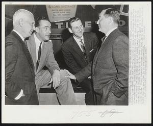 Spike Says "It's A Deal"--Spike Briggs (right), president of the Detroit, closes a deal with Chicago White Sox vice-president, Chuck Comiskey (second from left) as club officials of the two teams met on a stair case of hotel here today. The White Sox traded Virgil Trucks to Detroit for John "Bubba" Phillips in a straight player deal. Tiger general manager Muddy Ruel (left) and Chicago manager Marty Marion are also in on the proceedings.