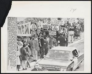 Anti-War March--The Vietnam Day Committee protest march gets started in nearby Berkeley, today. Police estimated there were 5,000 marchers at the start, but an hour later changed the number to an estimated 10,000. The demonstration was orderly, approved by a federal court order, which over-ruled objections of the Oakland City council which refused to give the committee a parade permit. In foreground is a California State Highway Patrol car.