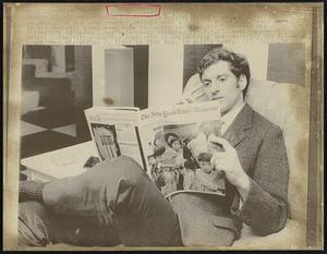 U.S. Draft Dodger Stephen Wohl, still interested in news from his home country, relaxes with a copy of a New York paper in his Montreal home. Wohl came to Canada in September 1966 from the University of Massachusetts, narrowly escaping the F.B.I. Wohl is now at McGill University doing his Doctorate in Engineering and assisting his fellow countrymen, who refuse to fight in Vietnam, to settle here.