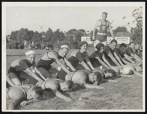 Life-saving course students at Magazine beach, Cambridge, show how to [illegible]