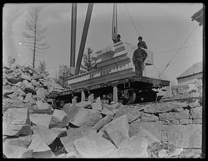 Boston Public Library under construction, cornice stone at quarry, side view
