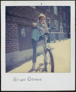 Brian Gomes posing on a bike
