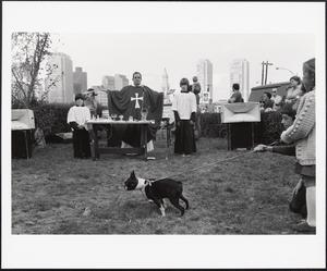 Father Walter Martin, chaplain of the Seaport of Boston, gives a St. Francis' "Blessing of the Animals" mass at the chapel of Our Lady of Good Voyage, Northern Ave.