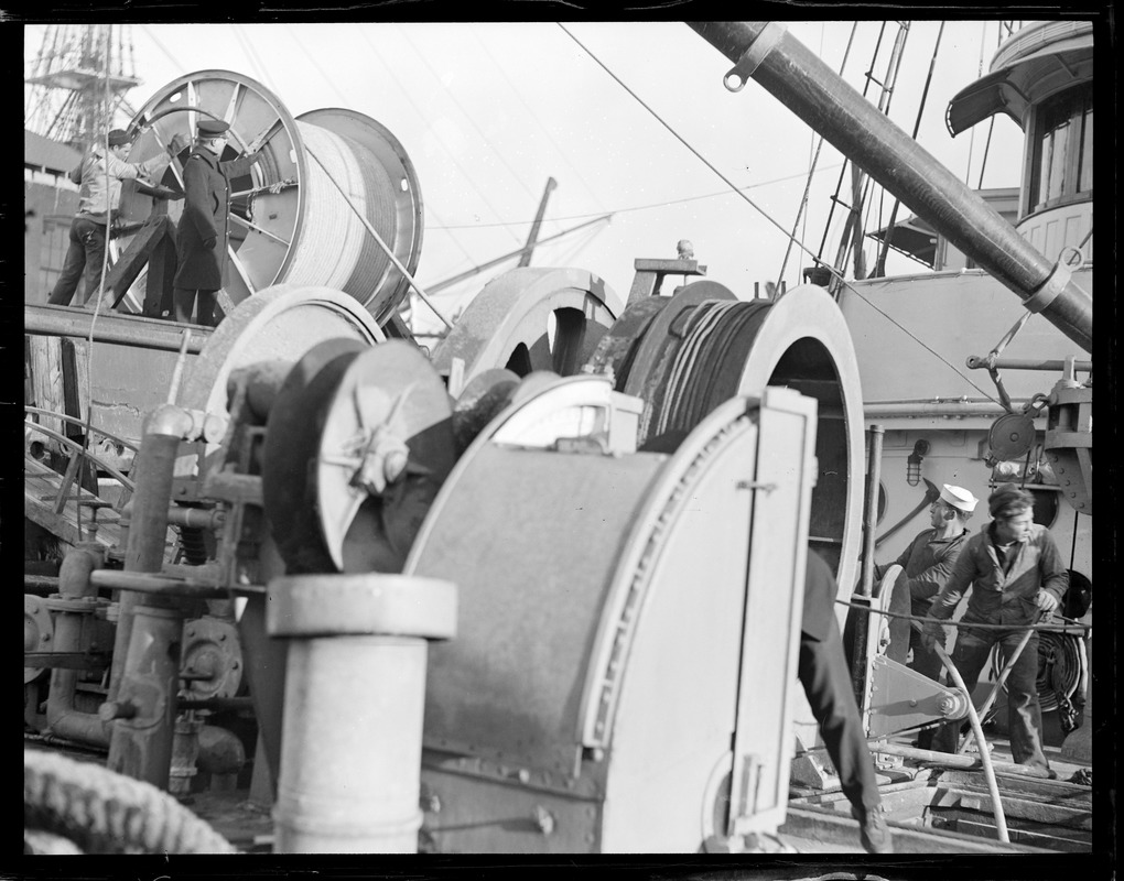 Men working on a Navy? Ship laying submarine cable? Digital Commonwealth