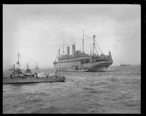 SS George Washington comes to Boston with President Wilson aboard. Shows patrol boats near by.