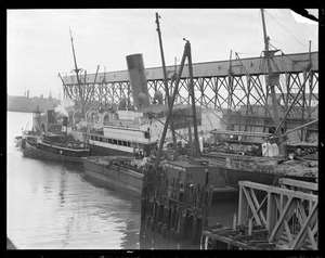 Docked ships ship listing. Tug. McKie Lighter Co. salvage boat