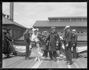 Commandant Rush of Charlestown Navy Yard with girl sponsor of the supply ship SS Bridge A16
