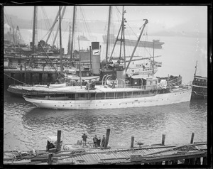 Tug Resolute keeps Edsel Ford's Sialia afloat at Atlantic Works, East Boston, after she was nearly wrecked on Hens and Chickens Reef
